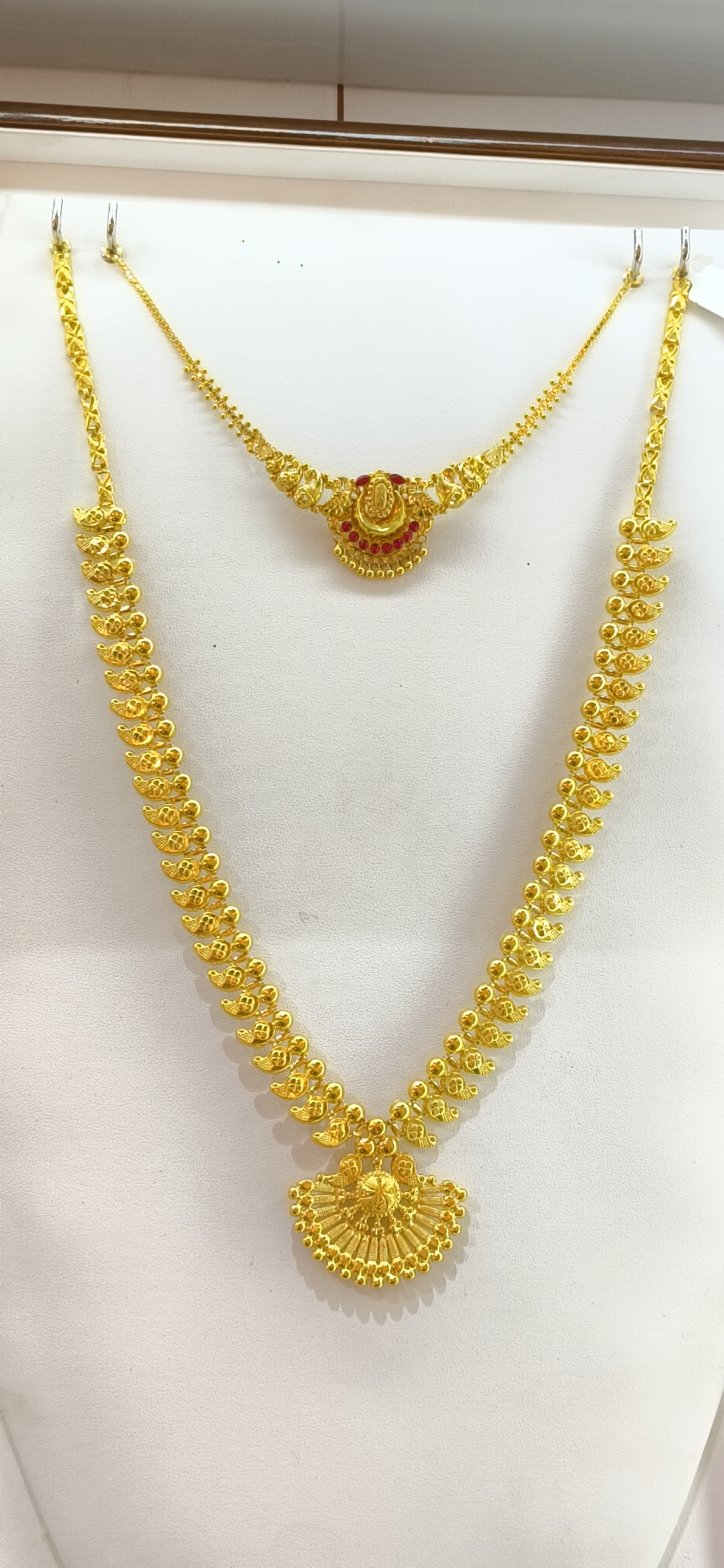 Peacock gold necklace design